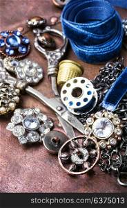 Stylish sewing accessories. Fashionable brooches and buttons from clothing. Retro style