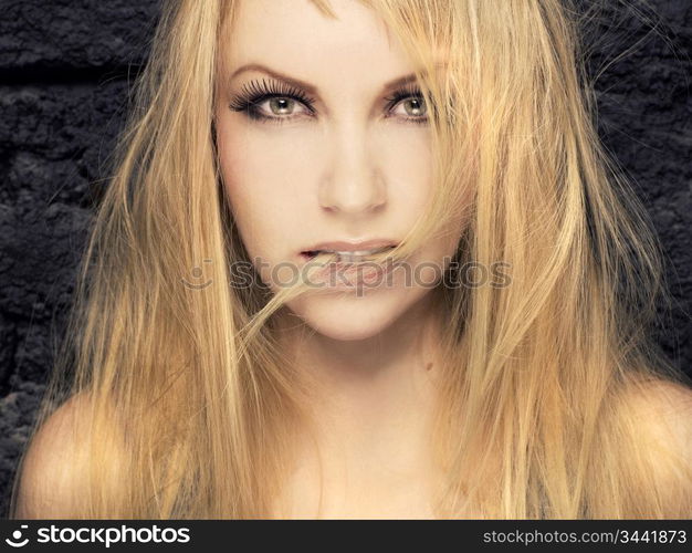 Stylish studio portrait of passionate sexy blonde