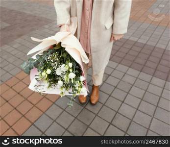stylish woman city holding bouquet flowers