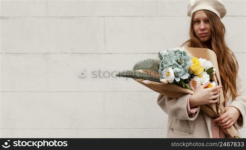 stylish woman outdoors holding bouquet flowers spring with copy space