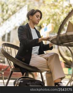 stylish woman sitting cafe