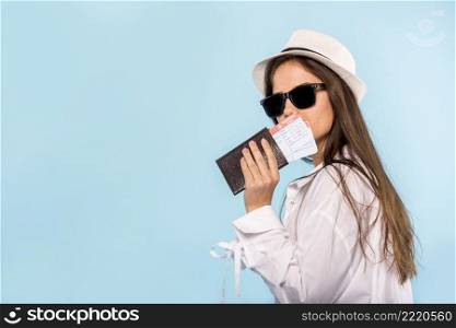 stylish woman with passport tickets