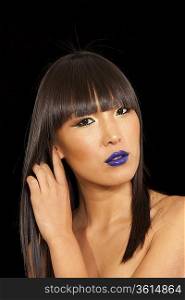 Stylish woman with straight hair and vibrant blue lipstick