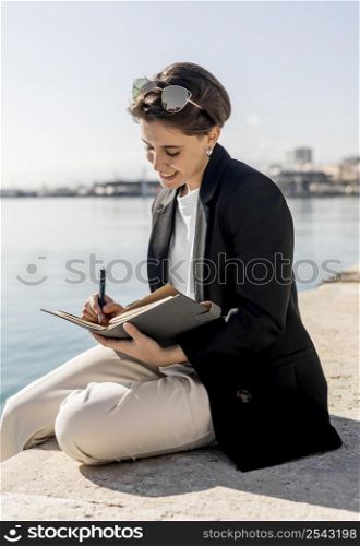 stylish woman writing notebook