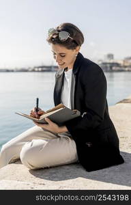 stylish woman writing notebook