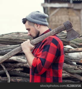 Stylish young man posing like lumberjack