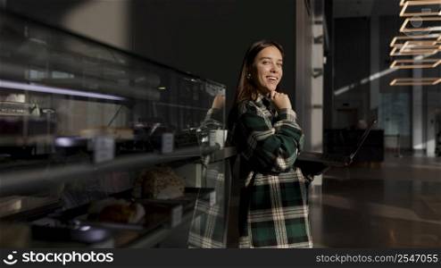 stylish young woman enjoying coffee