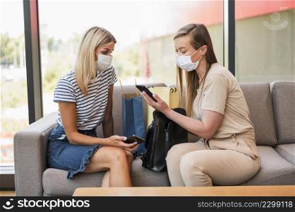 stylish young women browsing mobile phone