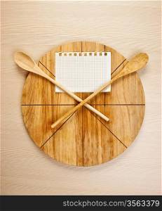 stylized clock - cutting board and wooden spoons