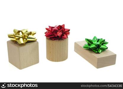 Stylized presents from wooden bricks and various bows isolated on white