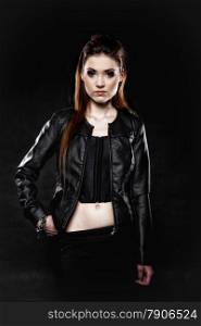 Subculture - beauty punk girl in leather jacket black background