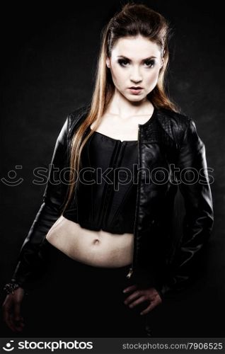Subculture beauty punk girl in leather jacket black background