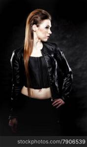 Subculture beauty punk girl in leather jacket black background