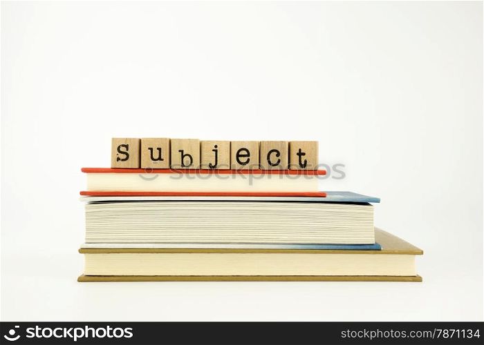 subject word on wood stamps stack on books, study and academic concept