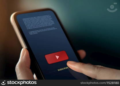 Subscribing and Digital Marketing Concept. Closeup of Woman using Smartphone to making Subscribe on a Favorite Channel. Media Content Strategy