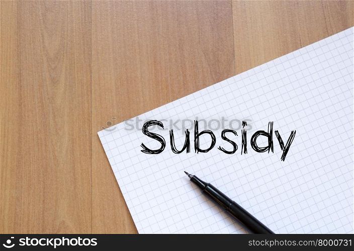 Subsidy text concept write on notebook with pen