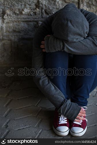 substance abuse, addiction, people and social issue concept - close up of addict woman hiding her face on street