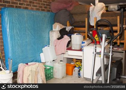 Suburban garage used as storage full of household items and mess