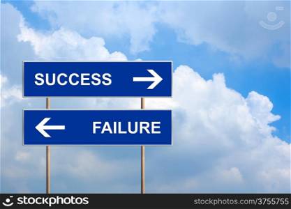 success and failure on blue road sign with blue sky