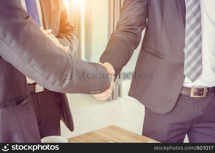 Success and happiness teamwork concept, Businessman handshake finishing up a meeting business partnership after good deal