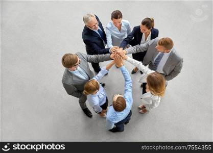 , success and teamwork concept - happy business team making high five in office. business people making high five in office