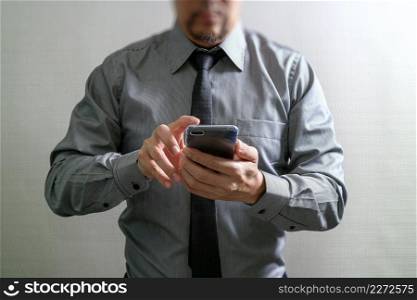 success businessman using smart phone ,front view,filter effect