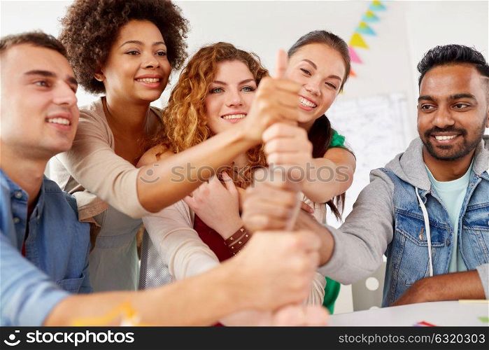 success concept - happy office workers doing teamwork gesture. happy office workers doing teamwork gesture