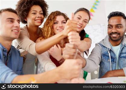 success concept - happy office workers doing teamwork gesture. happy office workers doing teamwork gesture