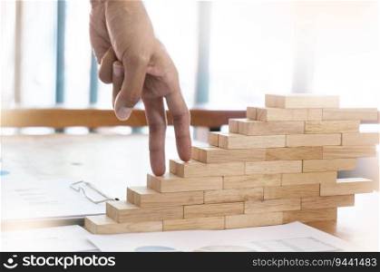 Success concept with business woman hand climbing wooden block stairs Business Concept
