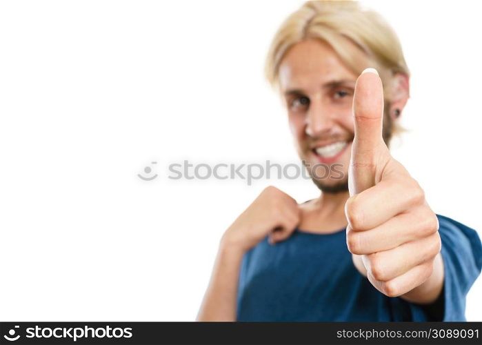 Success concept. Young college student giving thumb up hand sign gesture, isolated on white. Content young man giving thumb up