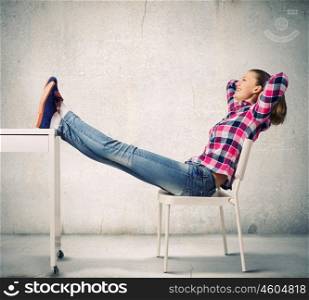 Success concept. Young woman in casual with arms up celebrating success