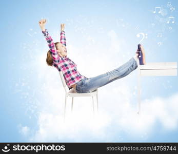 Success concept. Young woman in casual with arms up celebrating success