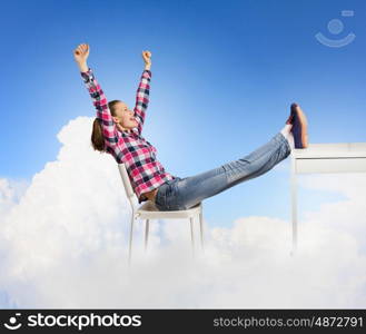 Success concept. Young woman in casual with arms up celebrating success