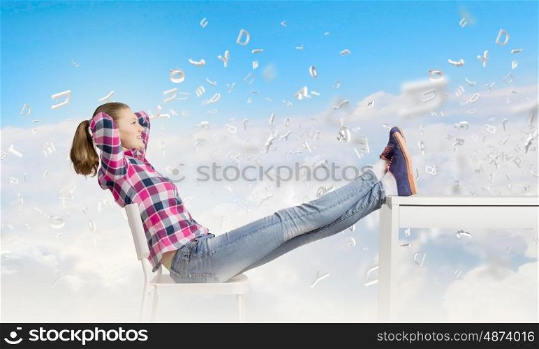 Success concept. Young woman in casual with legs on table