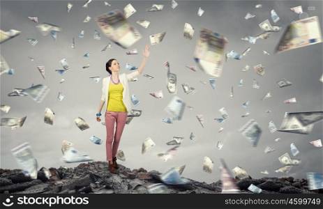 Success currency and lottery concept. Young pretty woman and falling money banknotes