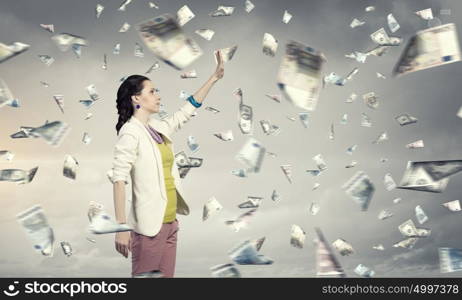 Success currency and lottery concept. Young pretty woman and falling money banknotes