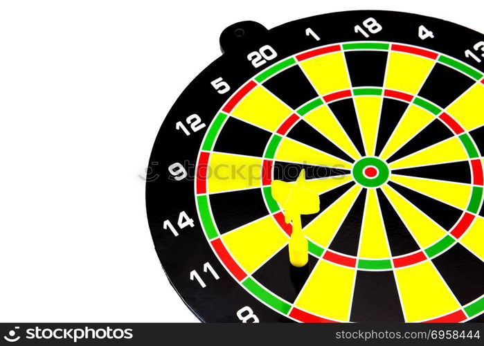 Success: dartboard and darts in bulls-eye