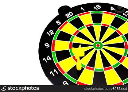 Success: dartboard and darts in bulls-eye