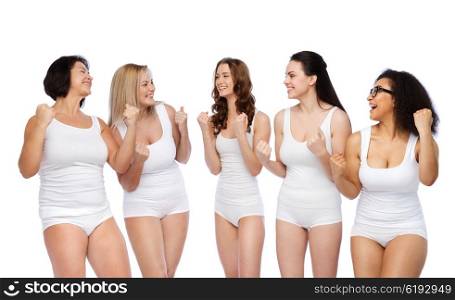 success, friendship, beauty, body positive and people concept - group of happy plus size women in white underwear celebrating victory