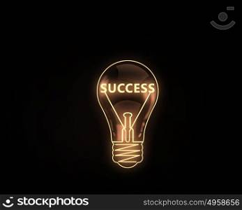 Success idea. Light bulb with concepts inside on dark background