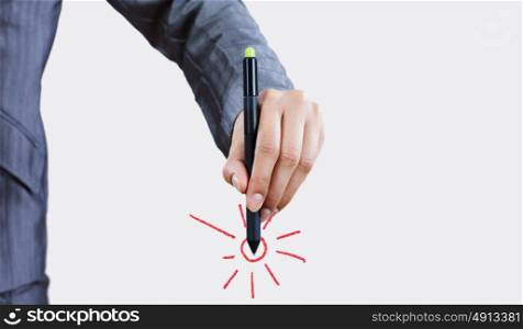 Success in business. Close up of businessman hand drawing sun