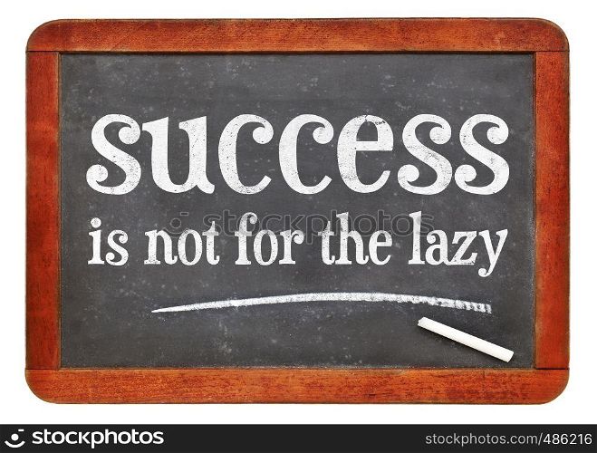 success is not for the lazy -white chalk text on a vintage slate blackboard. blackboard