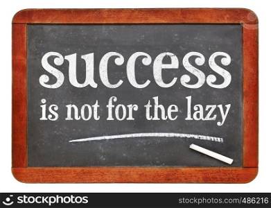 success is not for the lazy -white chalk text on a vintage slate blackboard. blackboard