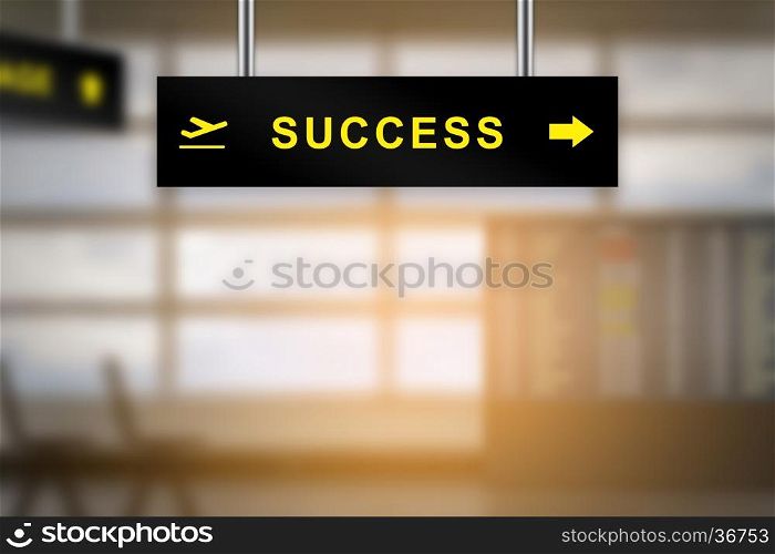 success on airport sign board with blurred background and copy space