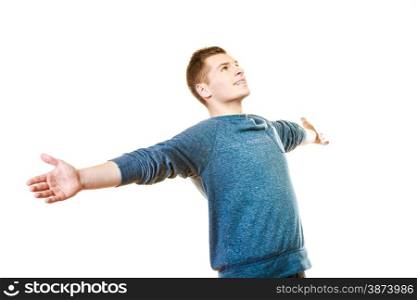Success positive emotions, happiness freedom. Happy young man successful lad with arms raised looking upwards isolated on white background