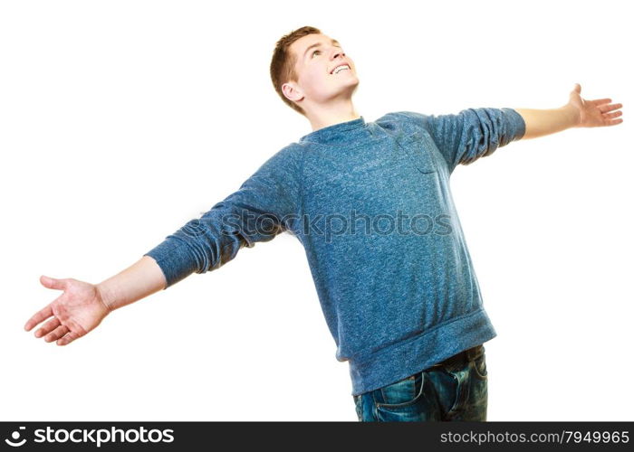 Success positive emotions, happiness freedom. Happy young man successful lad with arms raised looking upwards isolated on white background