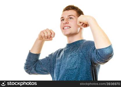 Success positive emotions. Happy young man successful lad with arms up looking upwards isolated on white background