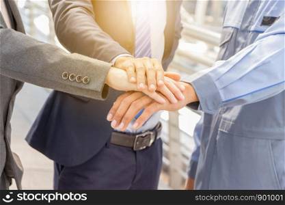 Success Teamwork concept, Business people joining hands city background.