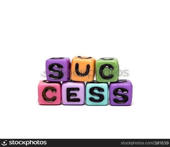 success - word made from multicolored child toy cubes with letters