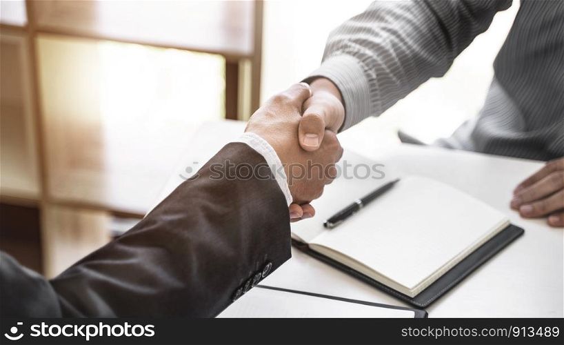 Successful agreement, Justice lawyer hand shaking with Client in courtroom.